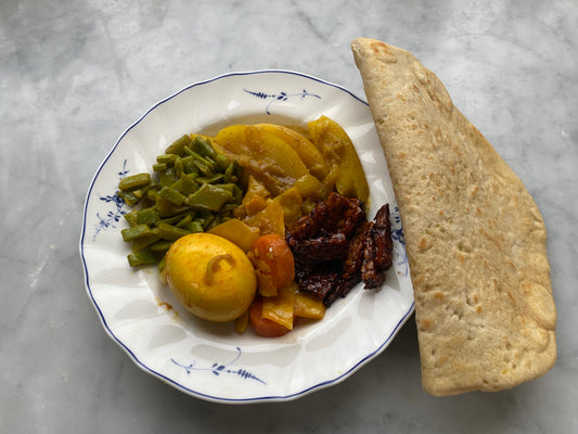 donderdag 30 mei vegetarische Surinaamse kerrie met gemarineerde tempé en roti